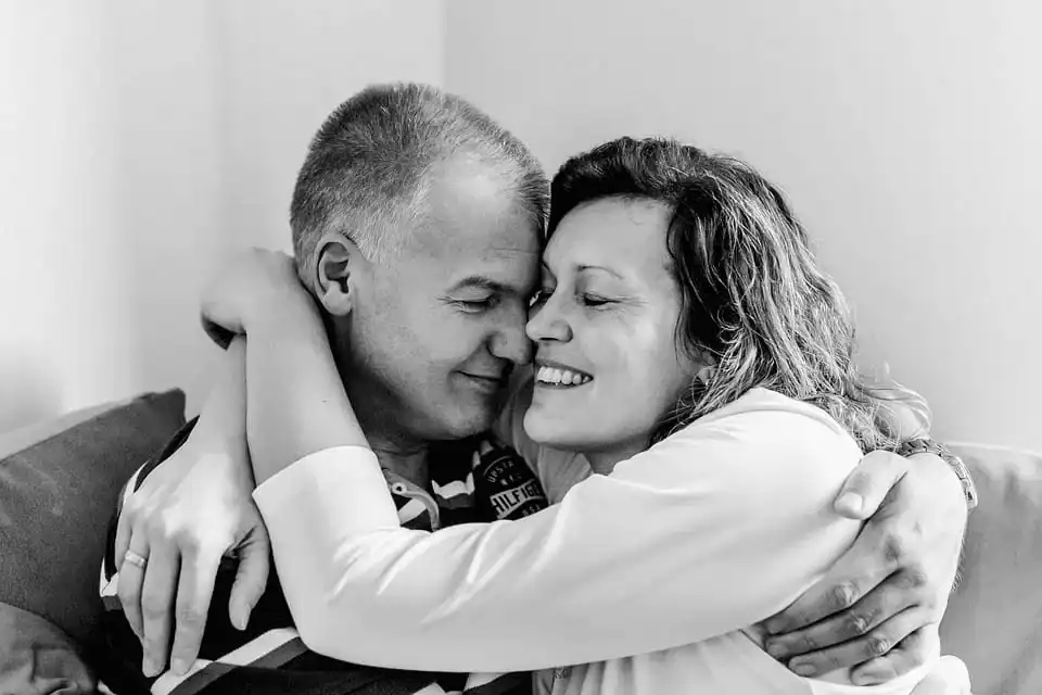 man and woman hugging Each other in living room