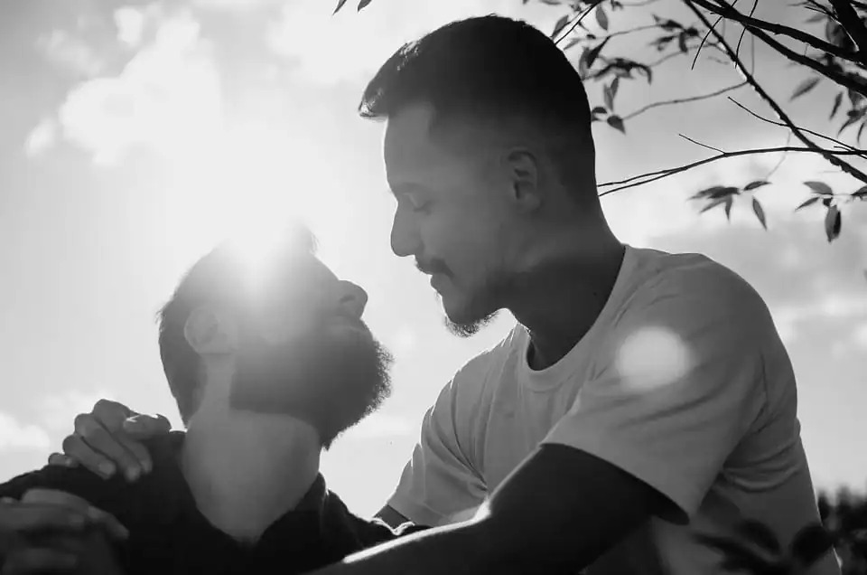 Happy gay couple outside in the sun Together